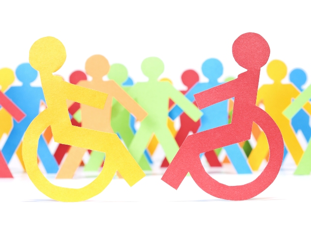 Picture showing paper cuttings of different persons, including those with disabilities